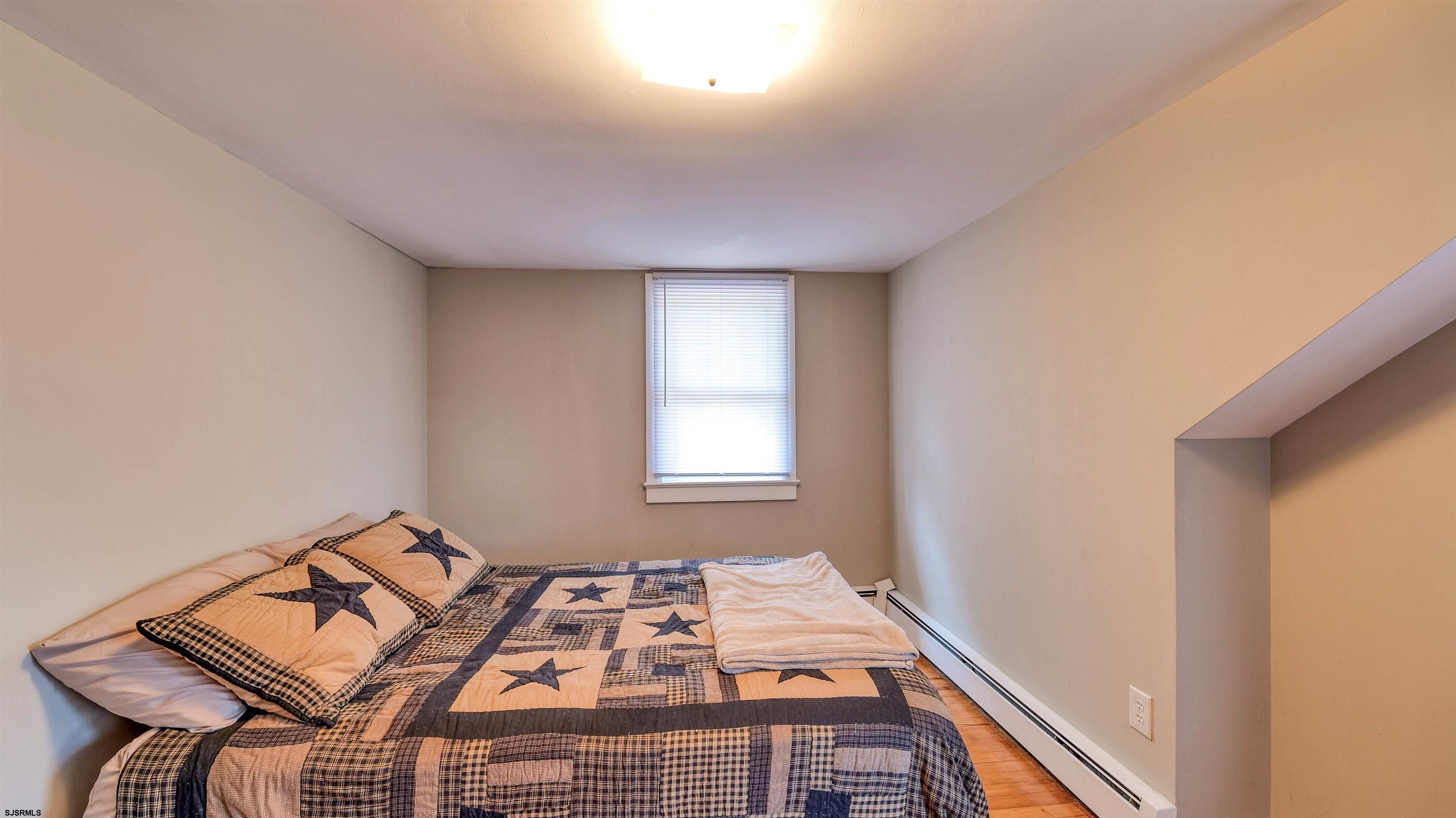 328 Llewellyn Avenue Richland, NJ 08350 - Photo 30 of 44 a bedroom with a bed and a window