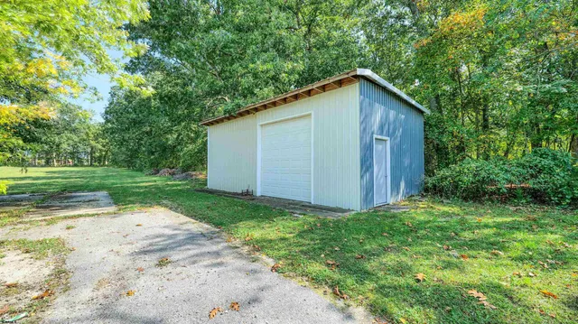 a view of a backyard with barn
