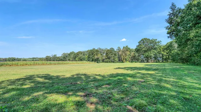 a view of a lake with a big yard