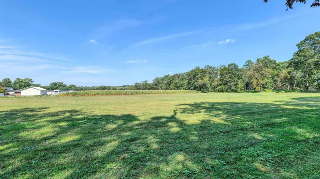 a view of an ocean and a yard