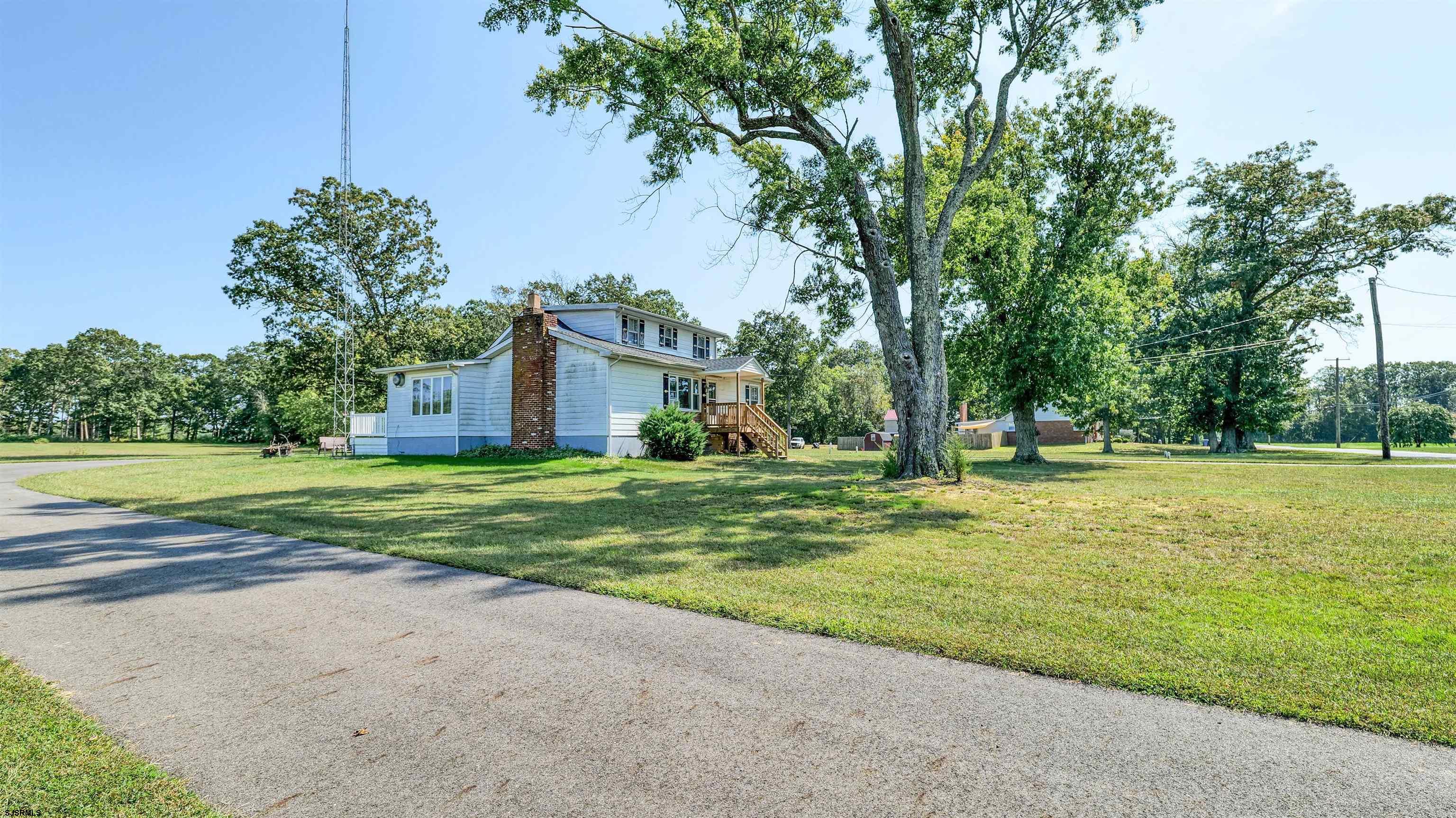 328 Llewellyn Avenue Richland, NJ 08350 - Photo 6 of 44 a view of a house with a big yard and palm trees
