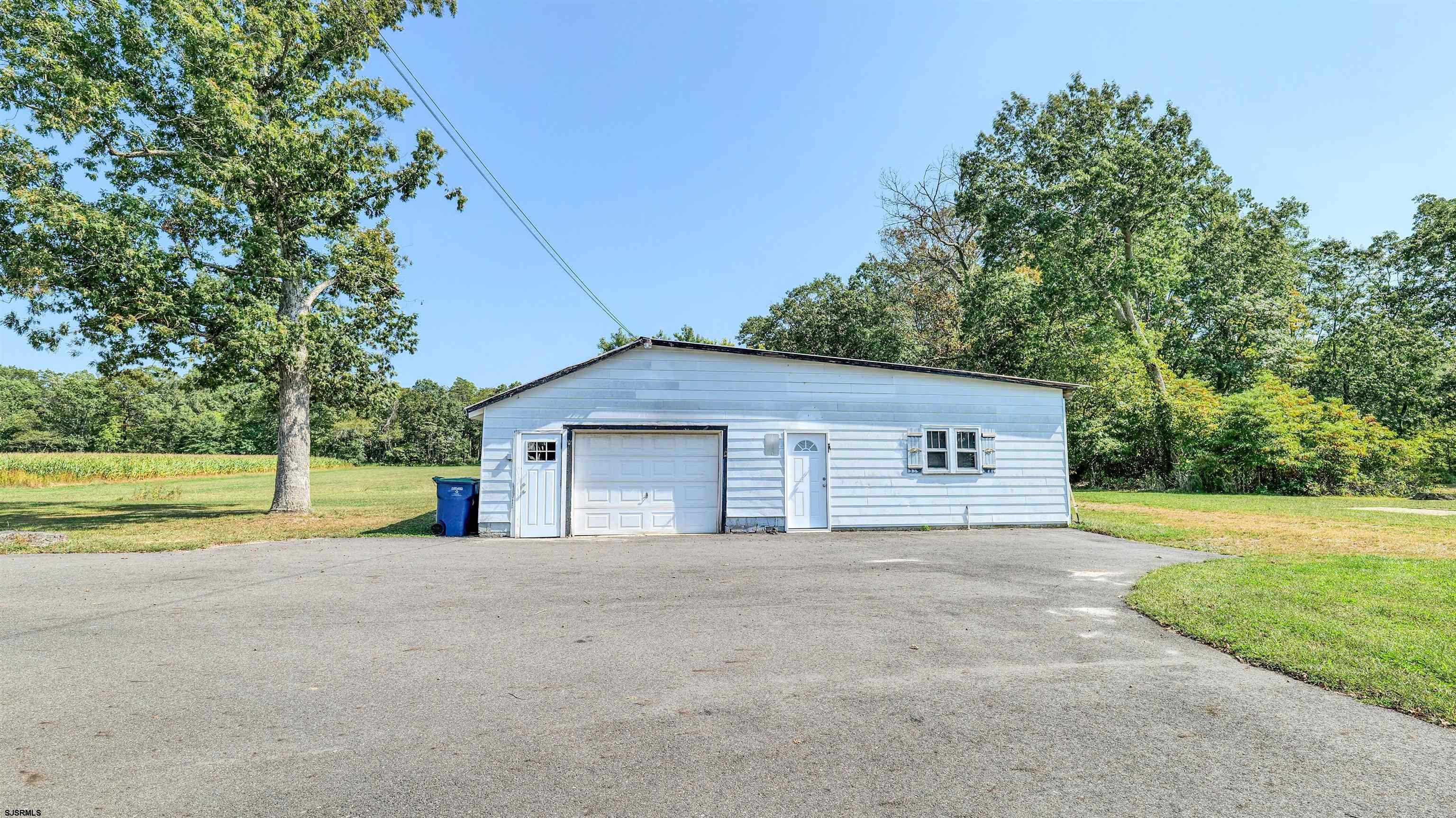 328 Llewellyn Avenue Richland, NJ 08350 - Photo 7 of 44 a front view of a house with a yard and garage