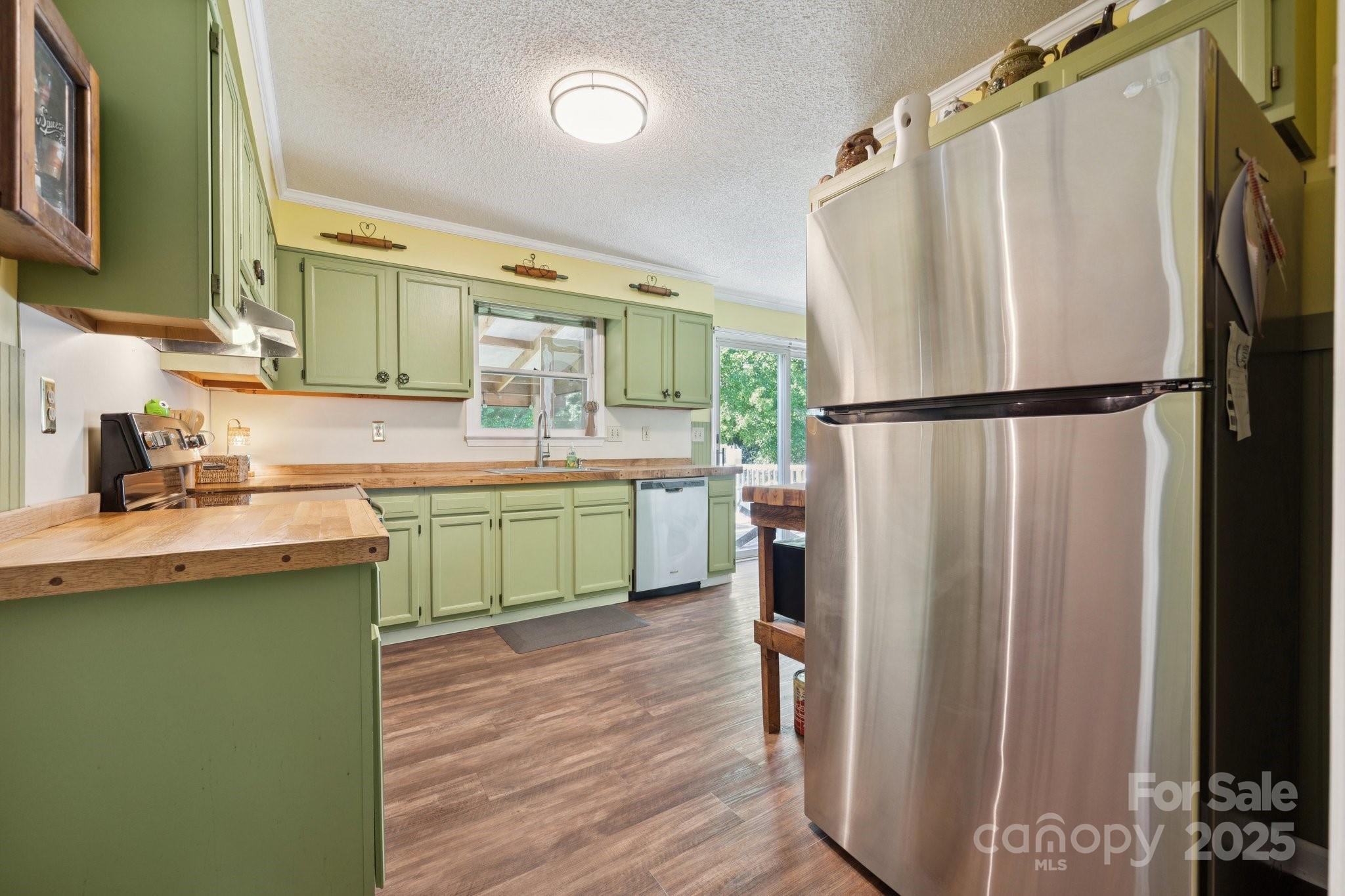1106 Birch Street Salisbury, NC 28146 - Photo 12 of 48 a kitchen with a refrigerator a sink and cabinets