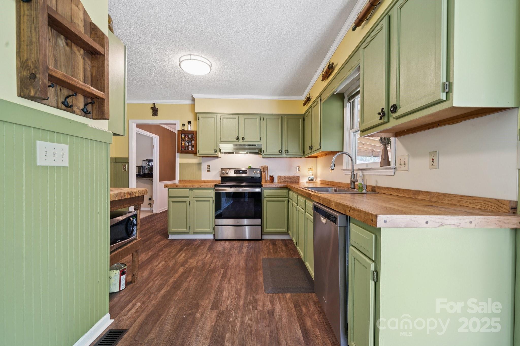 1106 Birch Street Salisbury, NC 28146 - Photo 13 of 48 a kitchen with stainless steel appliances granite countertop a refrigerator a stove top oven a sink and dishwasher