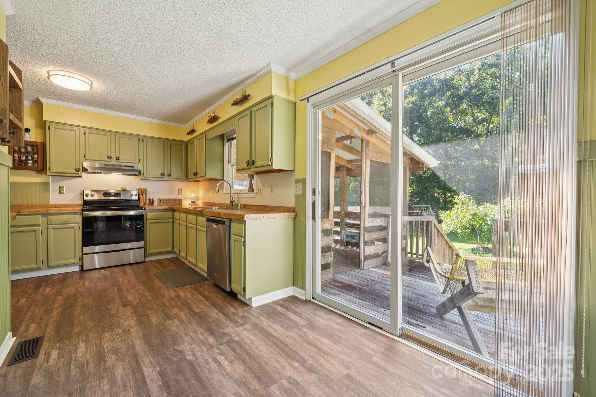 1106 Birch Street Salisbury, NC 28146 - Photo 16 of 48 a kitchen with stainless steel appliances granite countertop a stove a sink and a refrigerator