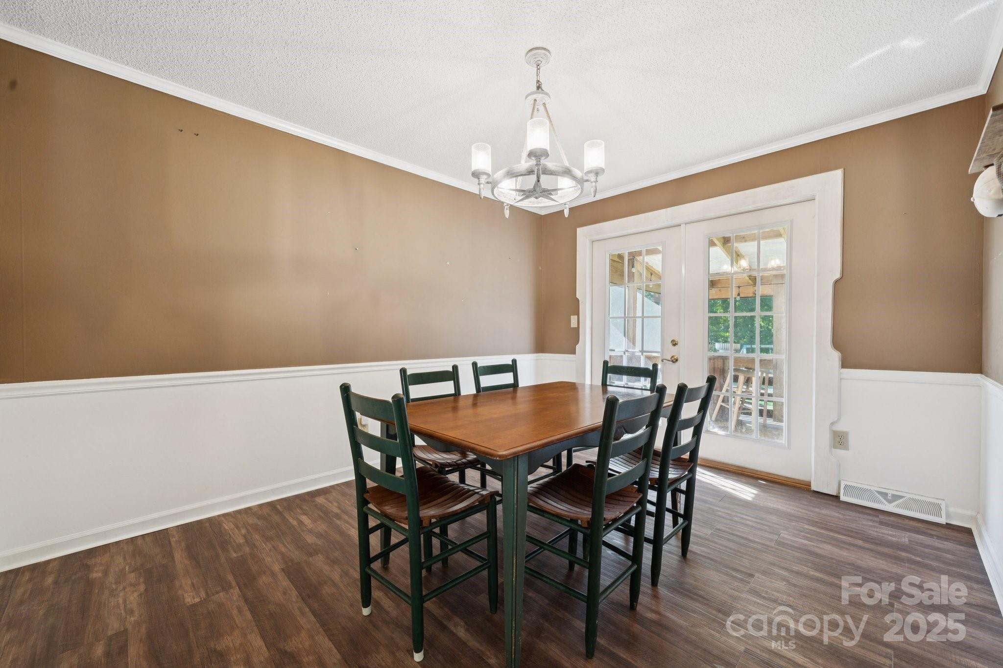 1106 Birch Street Salisbury, NC 28146 - Photo 20 of 48 a view of a dining room with furniture a chandelier and wooden floor
