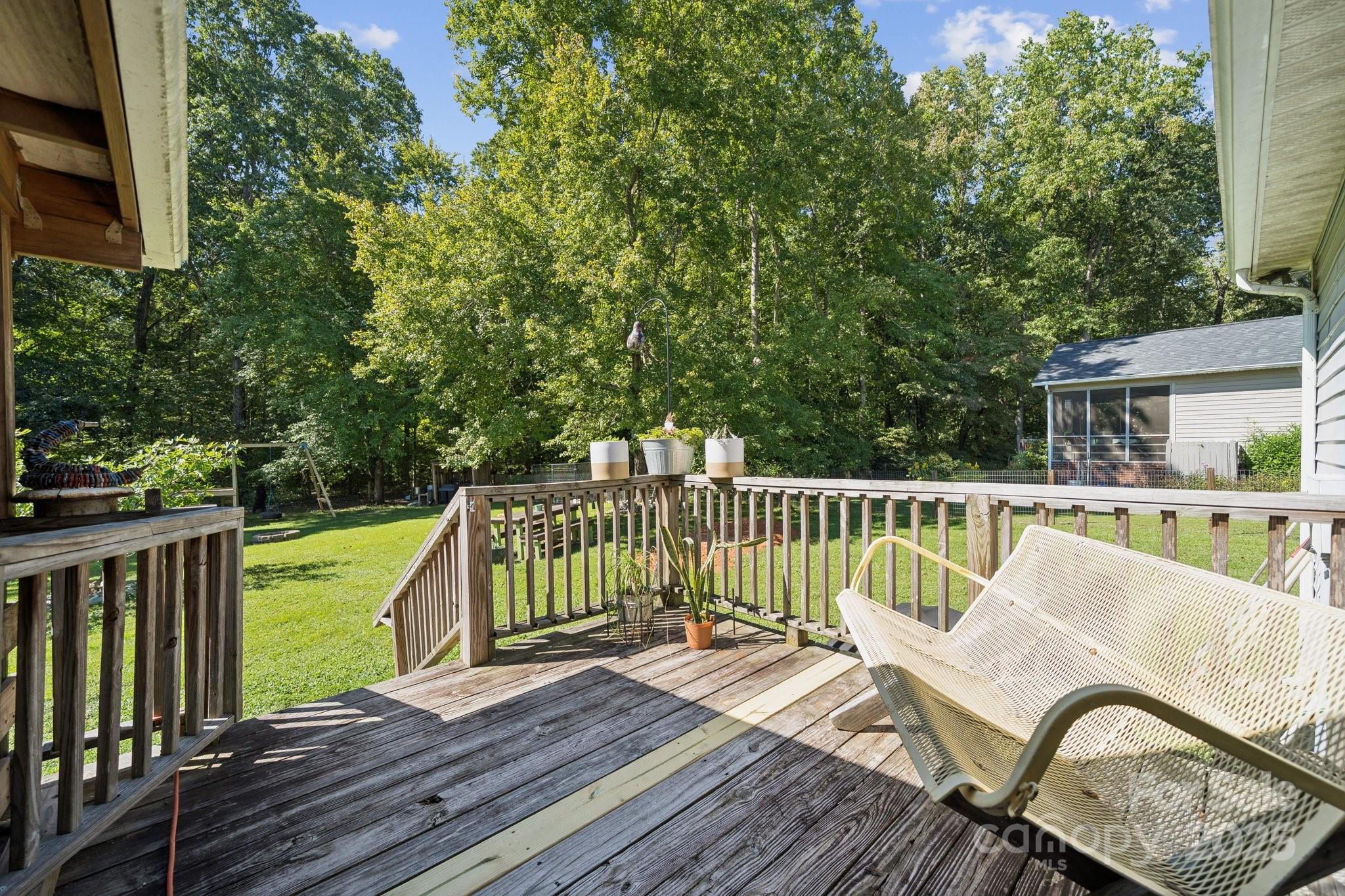 1106 Birch Street Salisbury, NC 28146 - Photo 40 of 48 a view of a deck with two chair and wooden floor