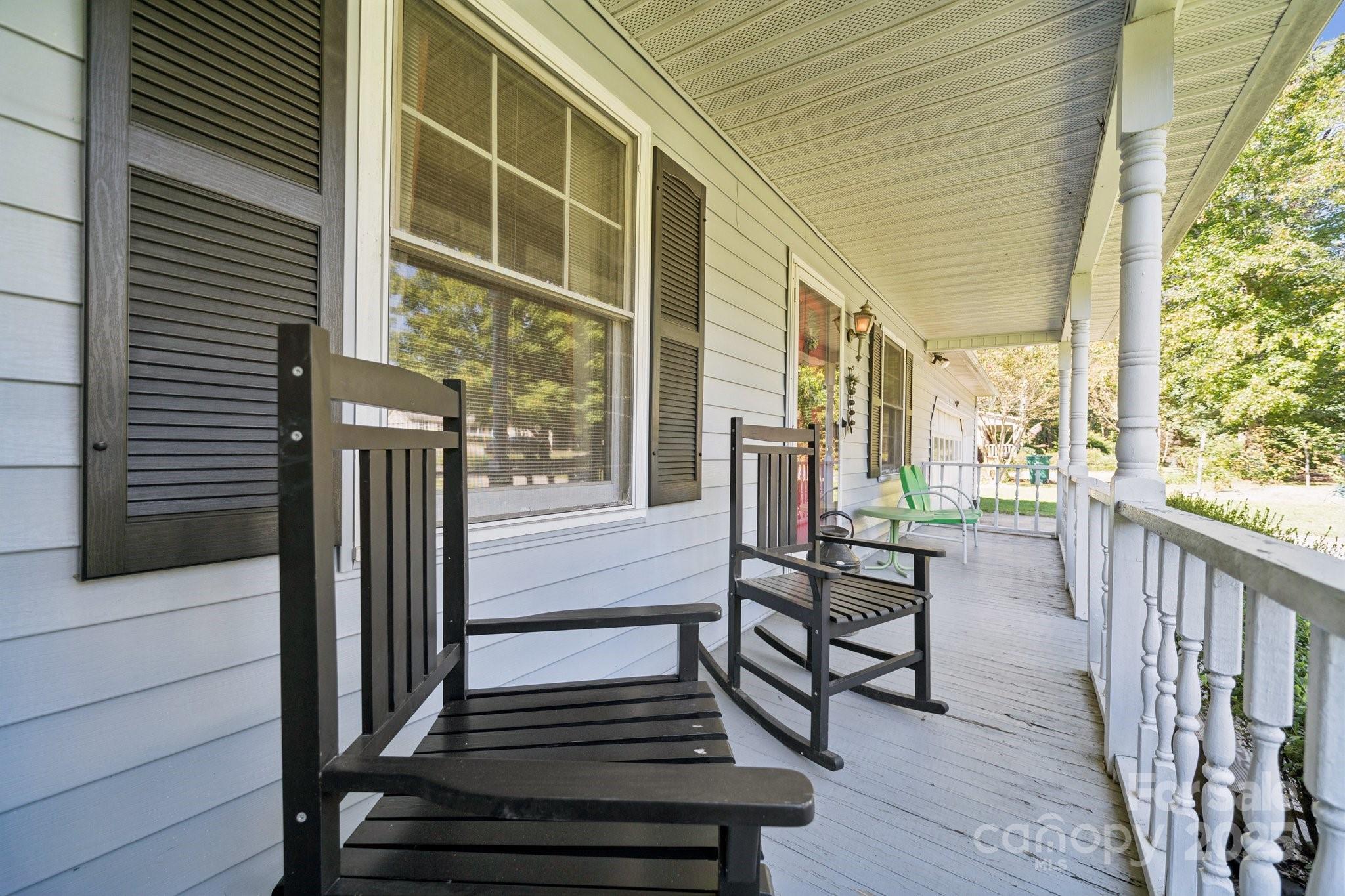 1106 Birch Street Salisbury, NC 28146 - Photo 5 of 48 a view of a balcony with chairs and wooden floor