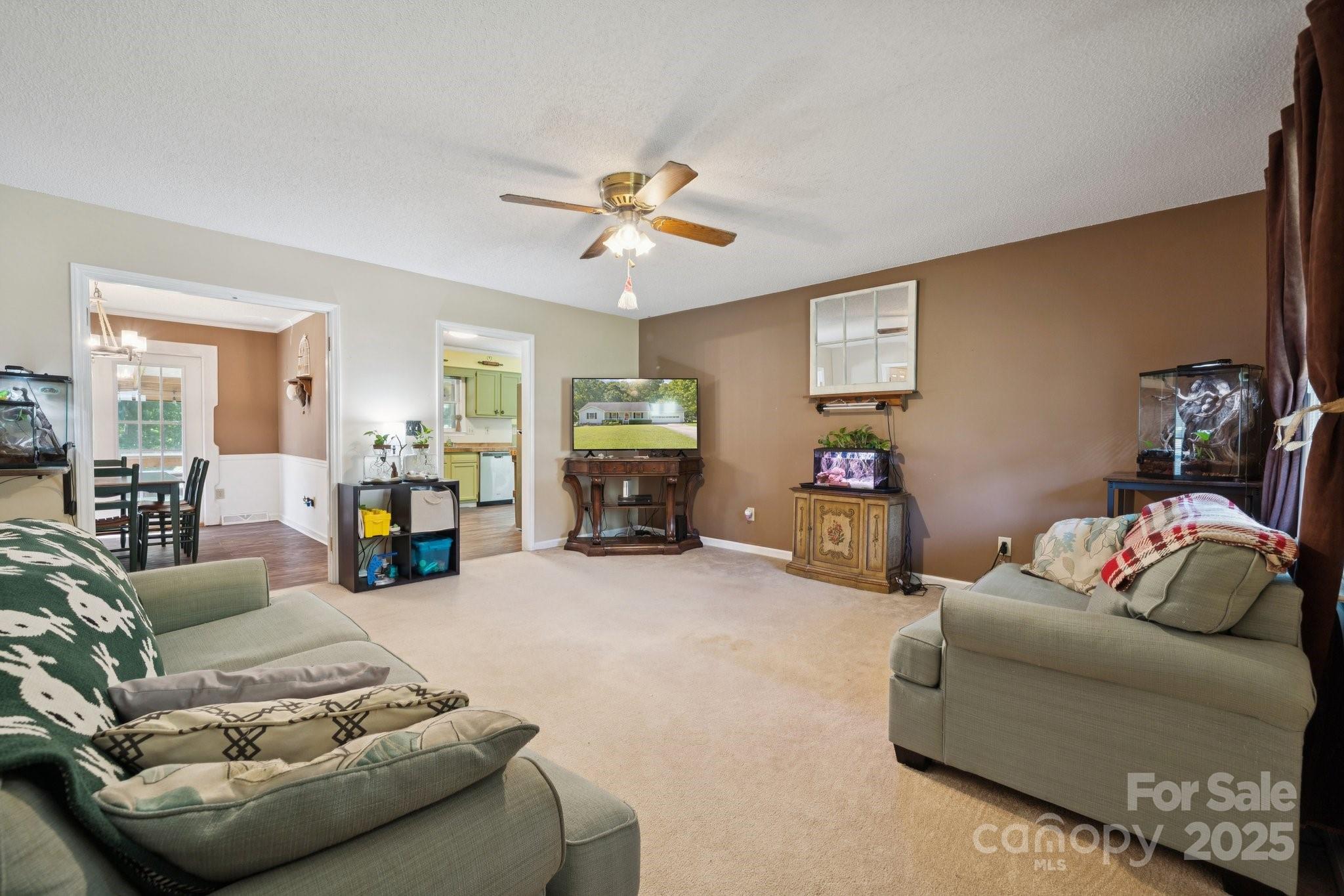 1106 Birch Street Salisbury, NC 28146 - Photo 7 of 48 a living room with furniture and a chandelier