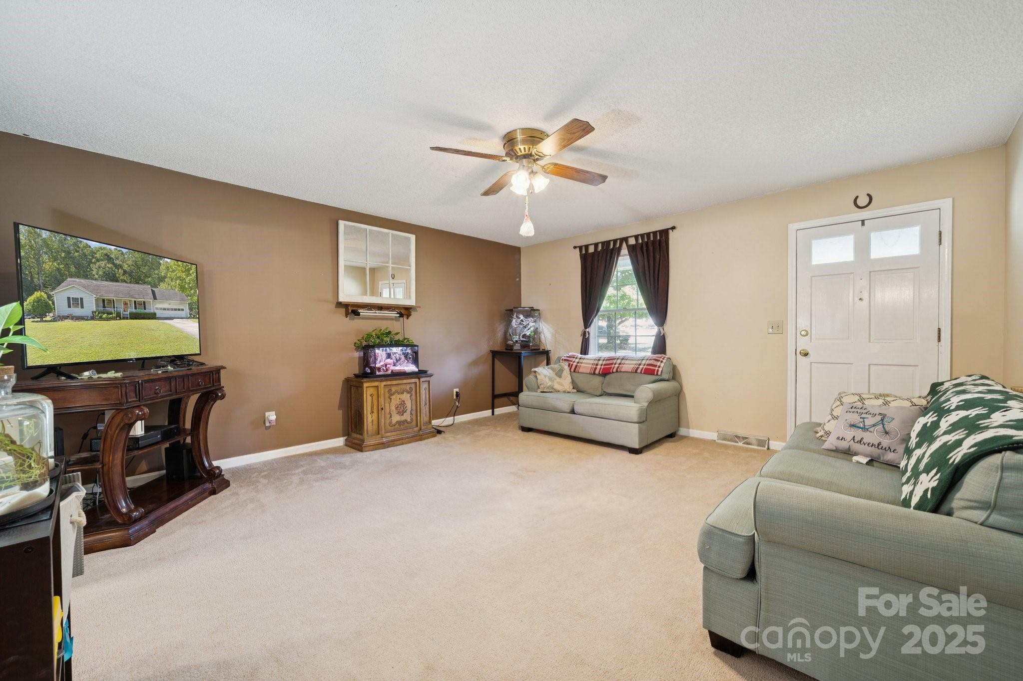 1106 Birch Street Salisbury, NC 28146 - Photo 8 of 48 a living room with furniture and a flat screen tv