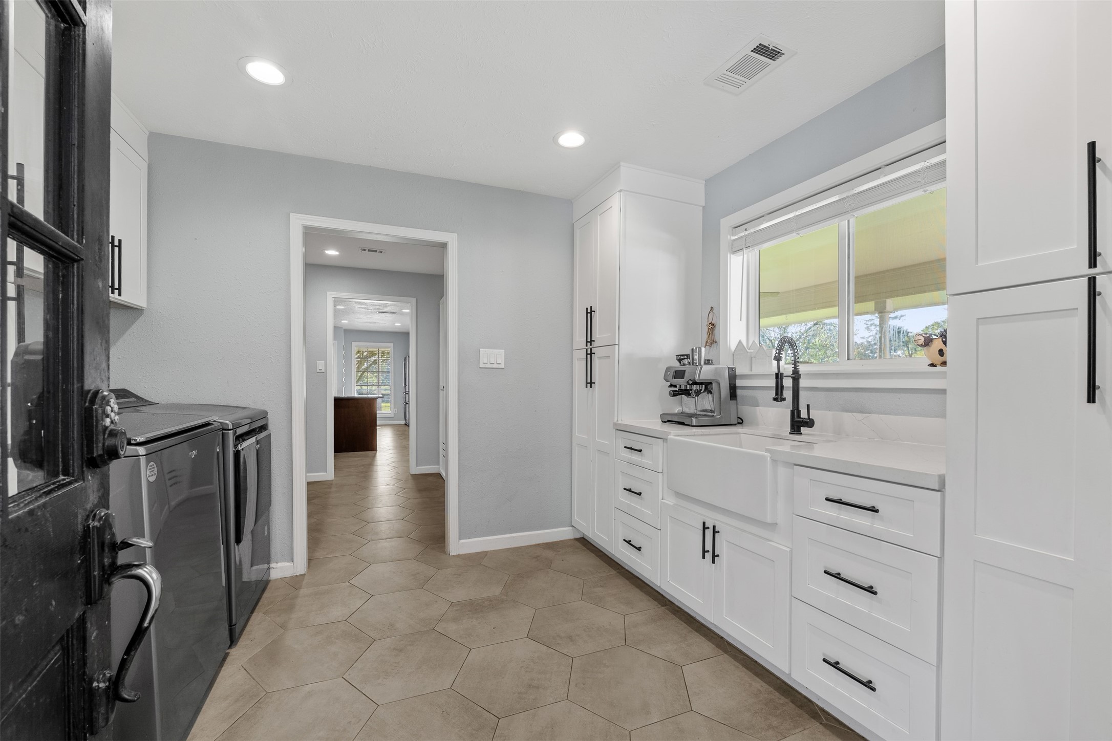 26515 Dobbin-Huffsmith Road Magnolia, TX 77354 - Photo 11 of 47 a bathroom with a sink a mirror and a window