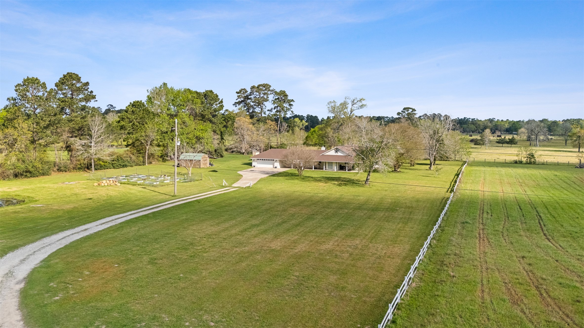26515 Dobbin-Huffsmith Road Magnolia, TX 77354 - Photo 2 of 47 a view of yard with swimming pool and trees