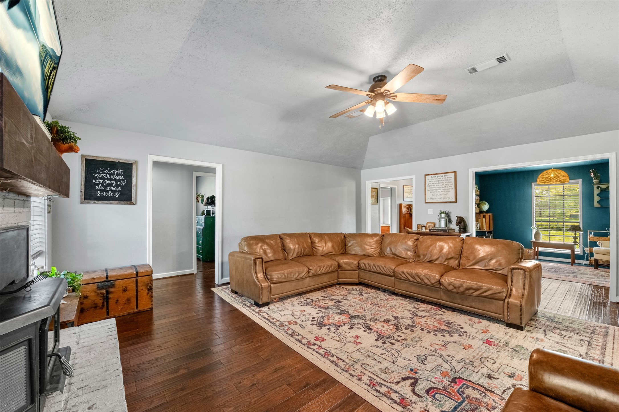 26515 Dobbin-Huffsmith Road Magnolia, TX 77354 - Photo 22 of 47 a living room with furniture and a flat screen tv