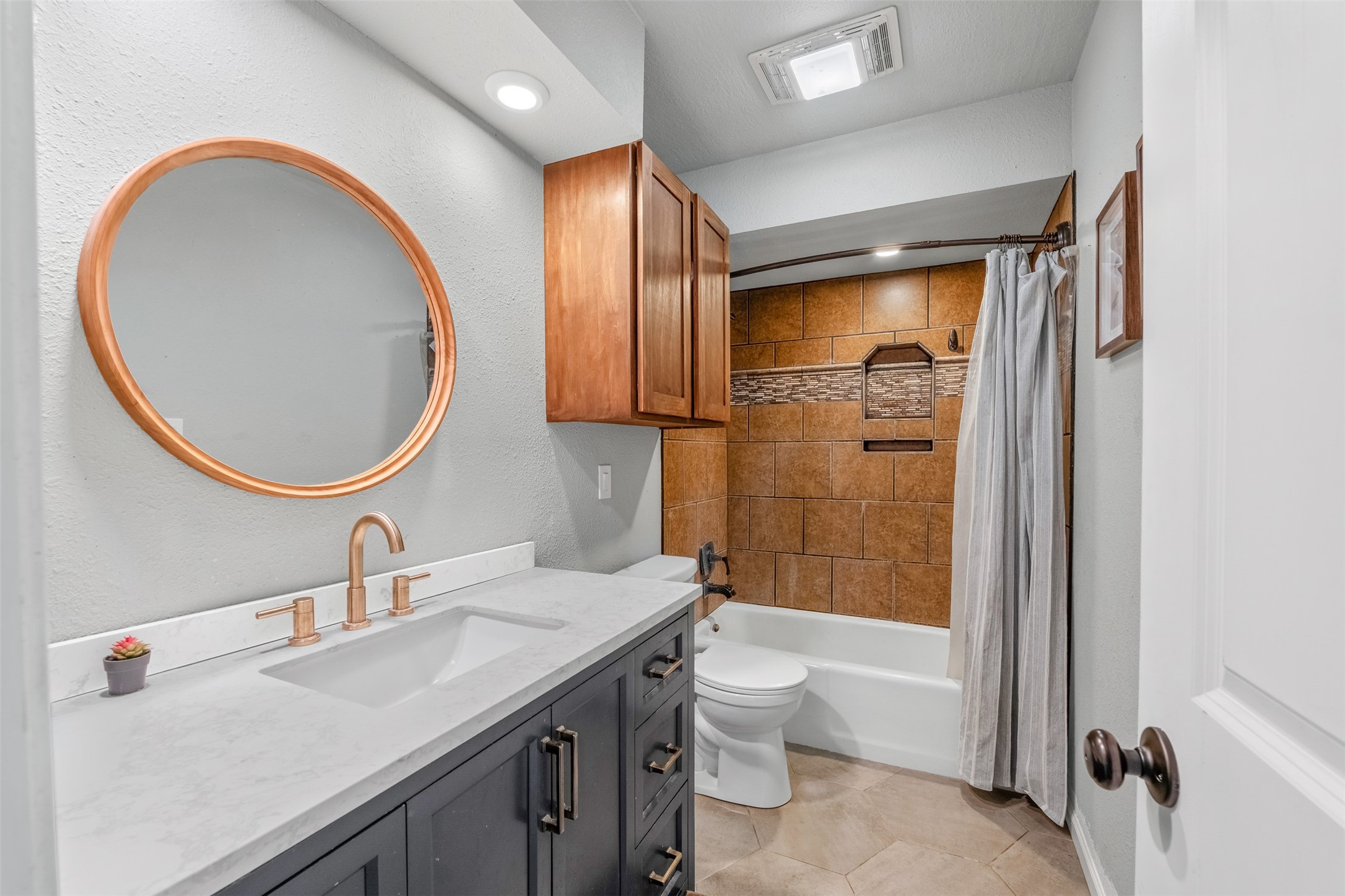 26515 Dobbin-Huffsmith Road Magnolia, TX 77354 - Photo 23 of 47 a bathroom with a sink a toilet and shower