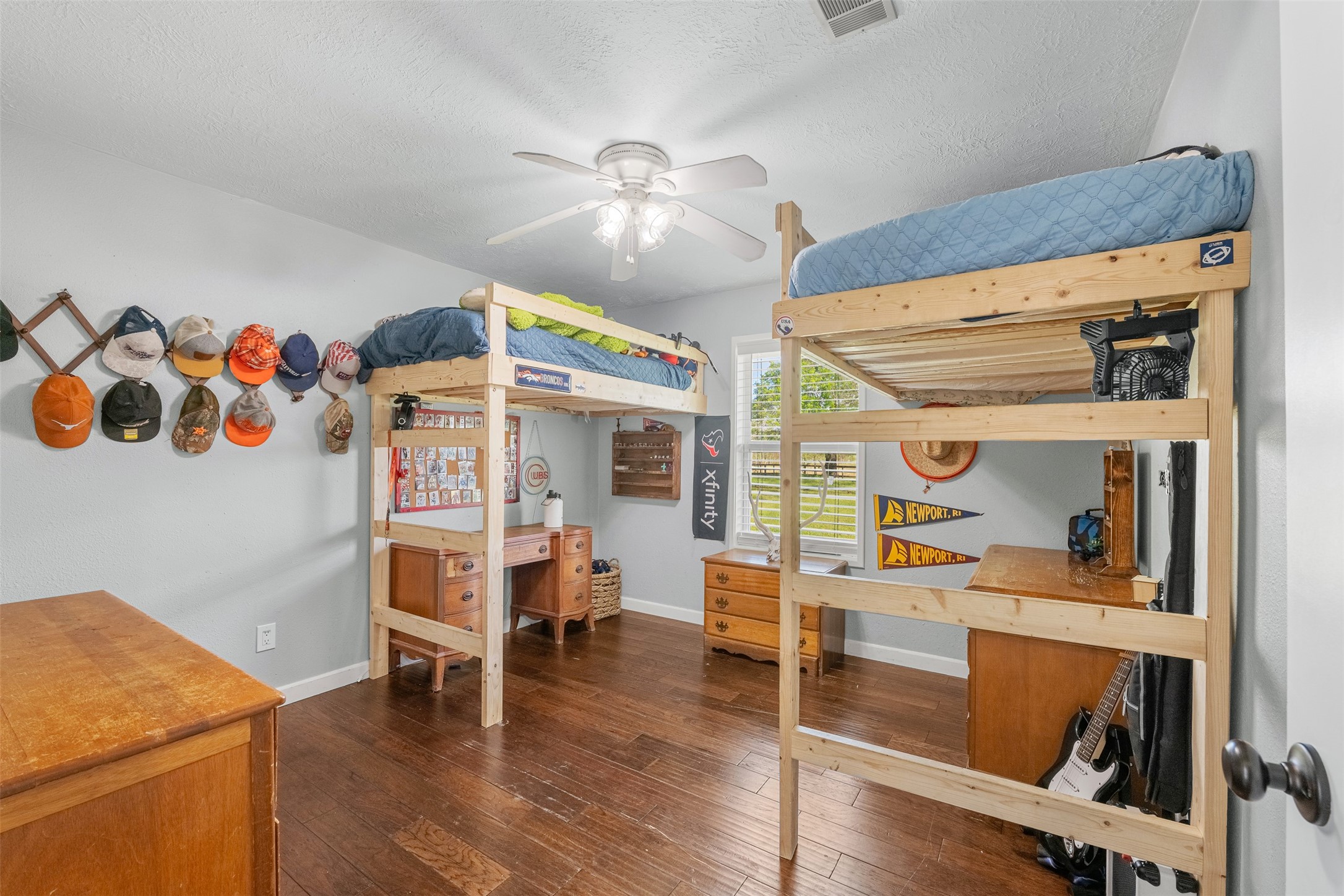 26515 Dobbin-Huffsmith Road Magnolia, TX 77354 - Photo 26 of 47 a bedroom with furniture and a wooden floor