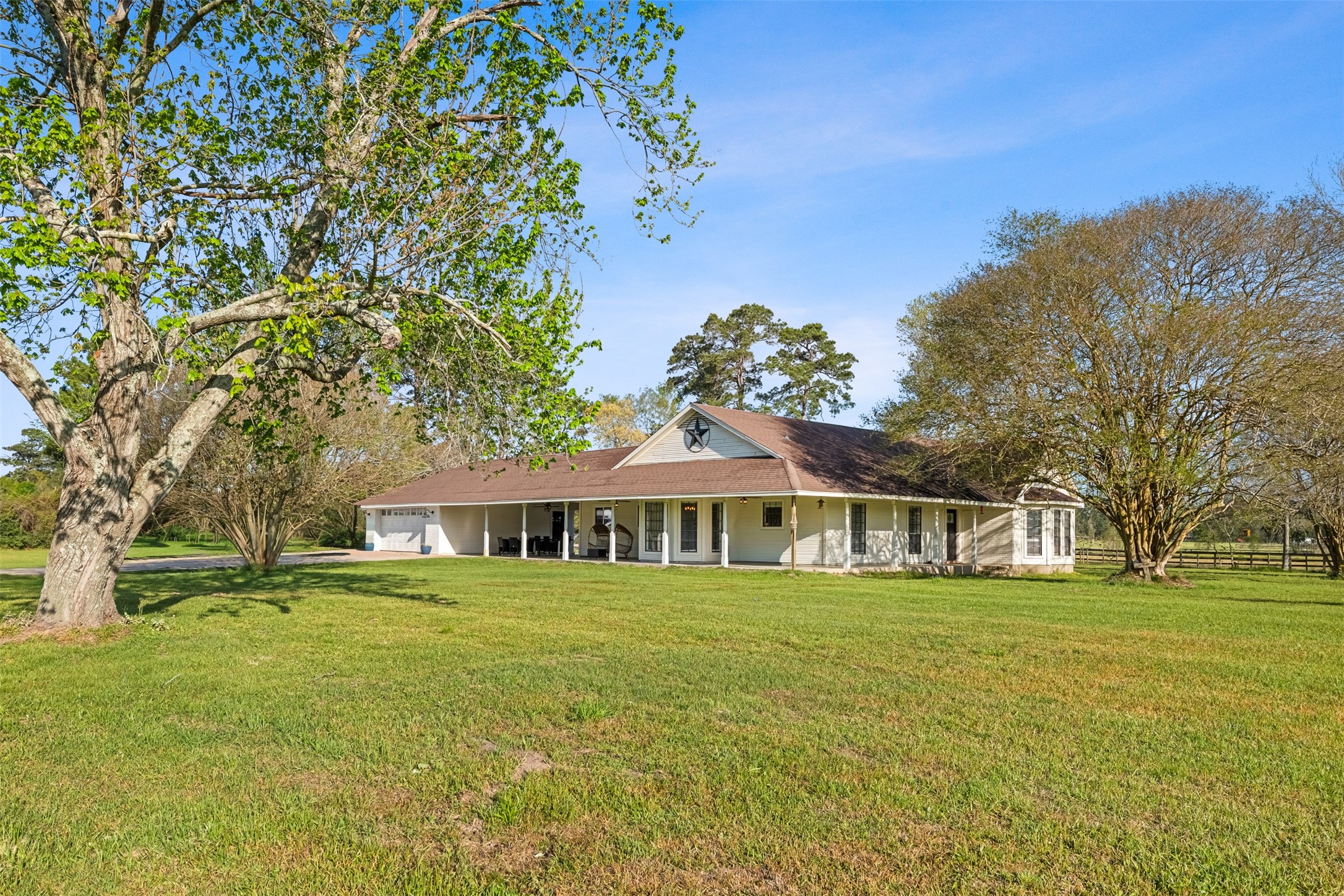 26515 Dobbin-Huffsmith Road Magnolia, TX 77354 - Photo 3 of 47 a front view of a house with a yard