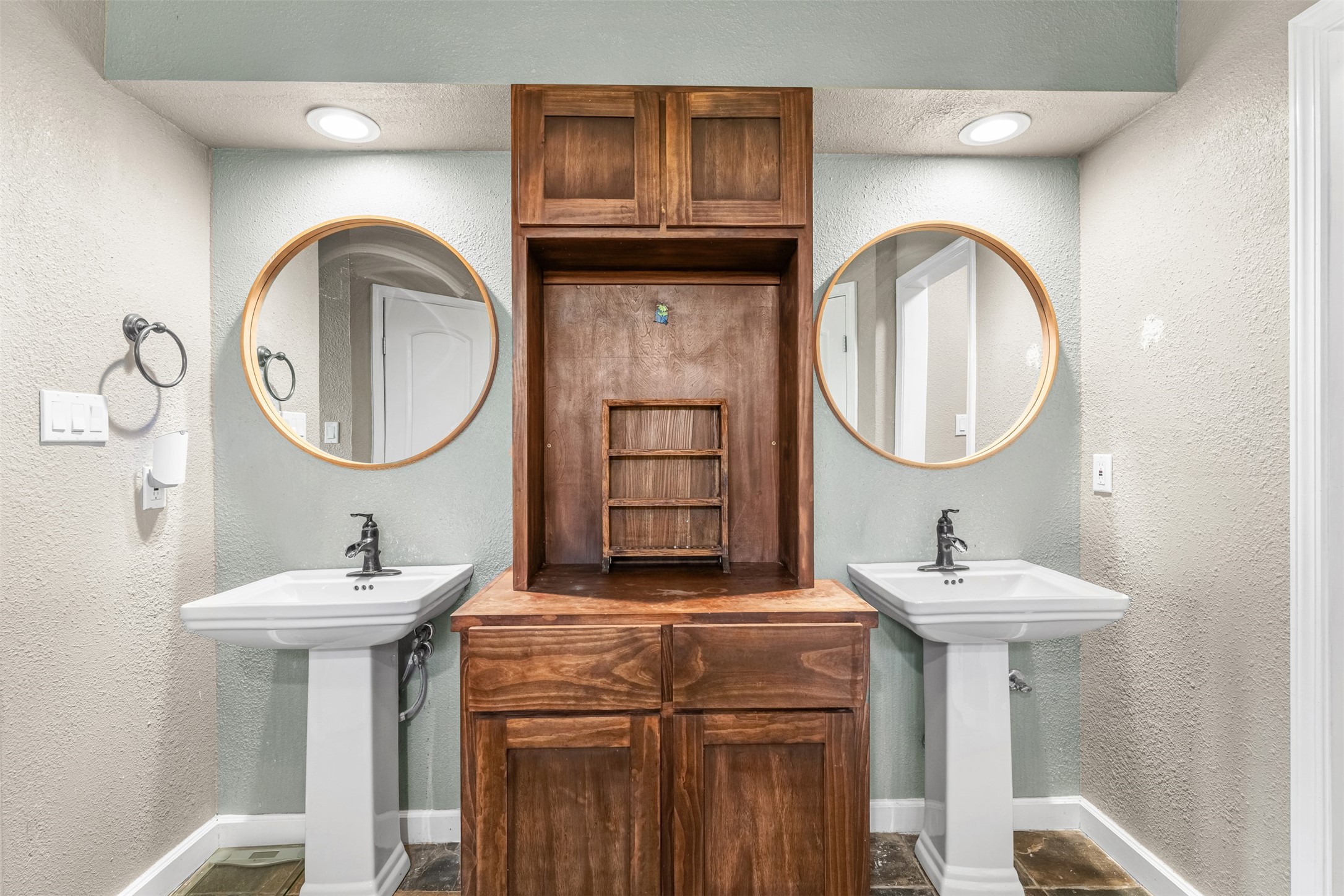 26515 Dobbin-Huffsmith Road Magnolia, TX 77354 - Photo 31 of 47 a bathroom with a sink and a mirror