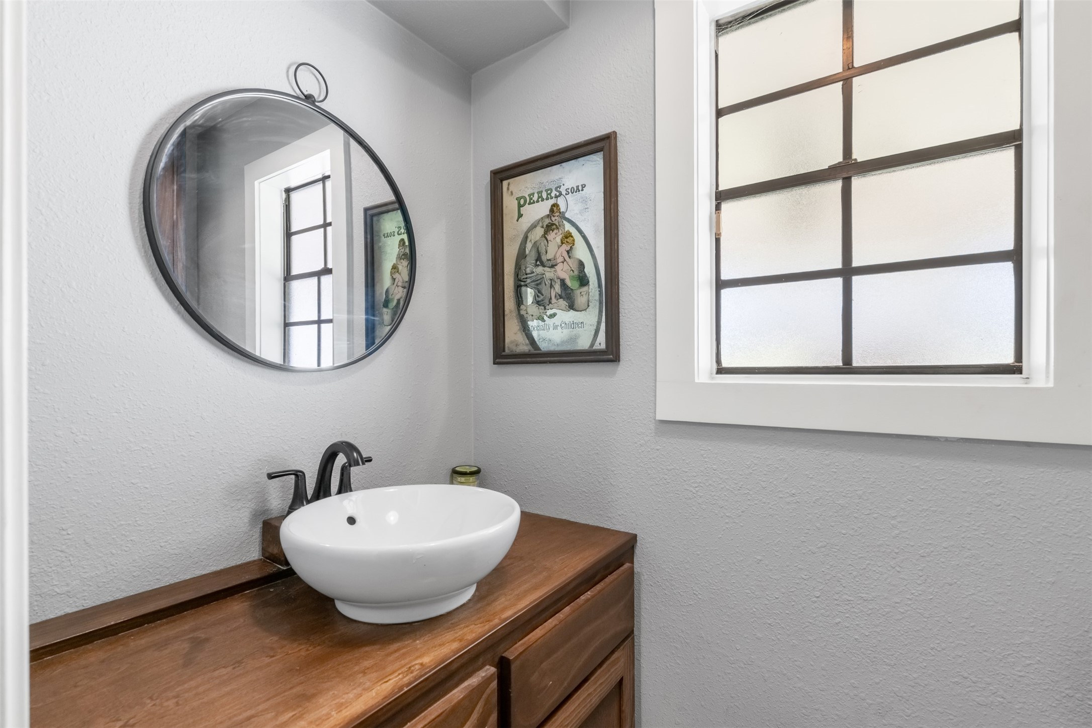 26515 Dobbin-Huffsmith Road Magnolia, TX 77354 - Photo 34 of 47 a bathroom with a sink and a mirror