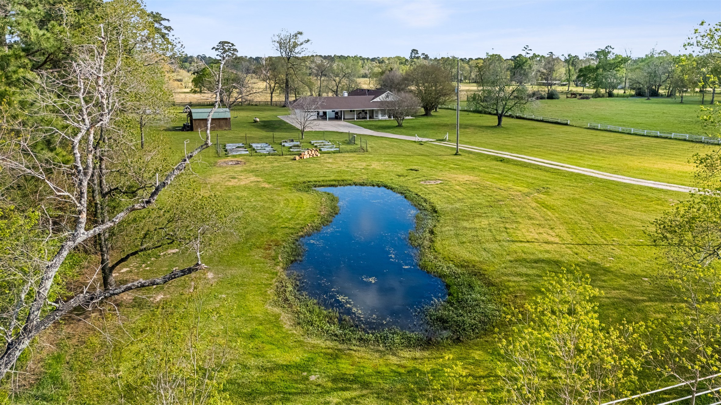 26515 Dobbin-Huffsmith Road Magnolia, TX 77354 - Photo 39 of 47 a swimming pool with trees in the background