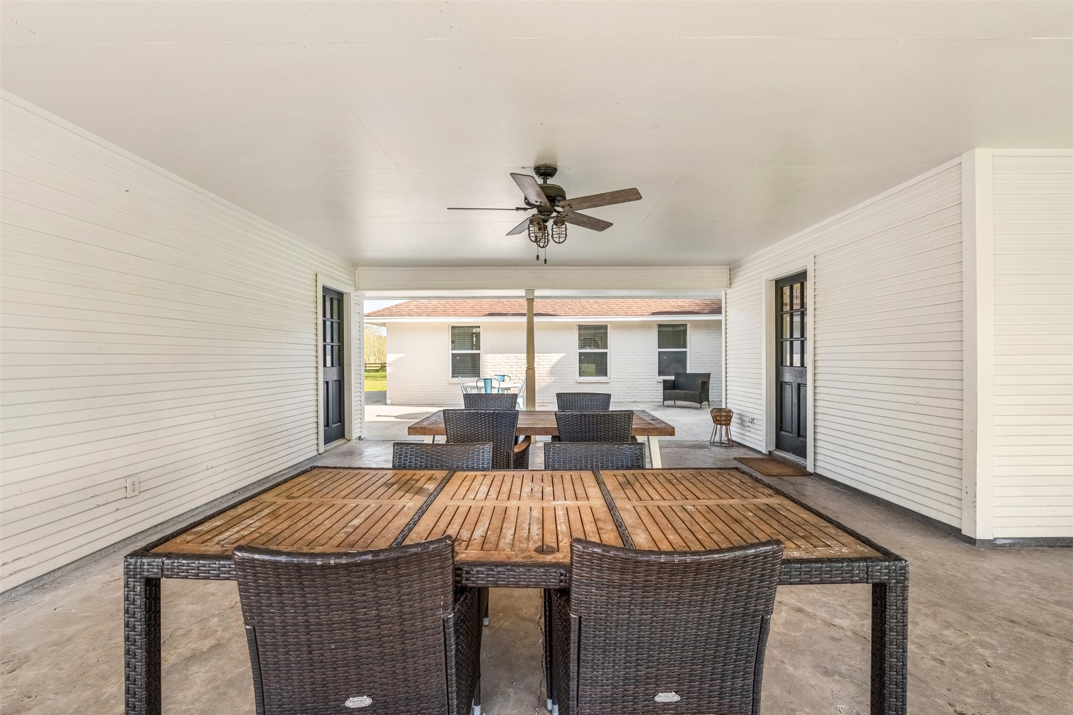 26515 Dobbin-Huffsmith Road Magnolia, TX 77354 - Photo 9 of 47 a view of a livingroom with furniture and a ceiling fan