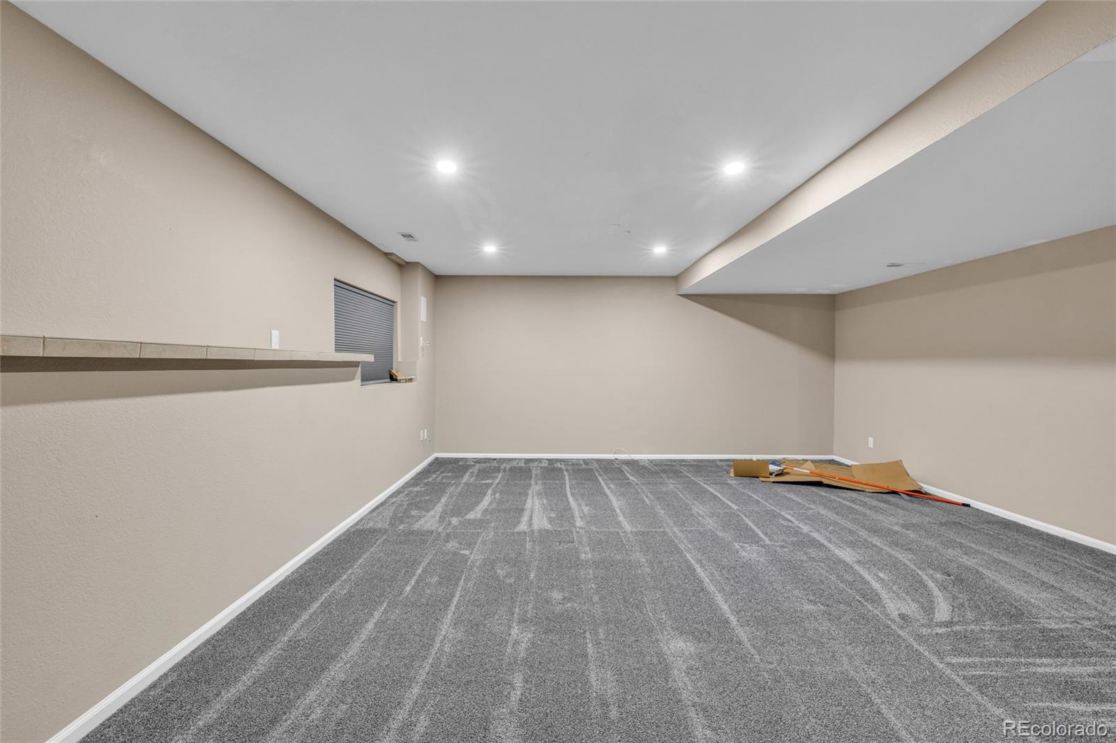 8204 Swadley Street Arvada, CO 80005 - Photo 27 of 39 a view of empty room with wooden floor