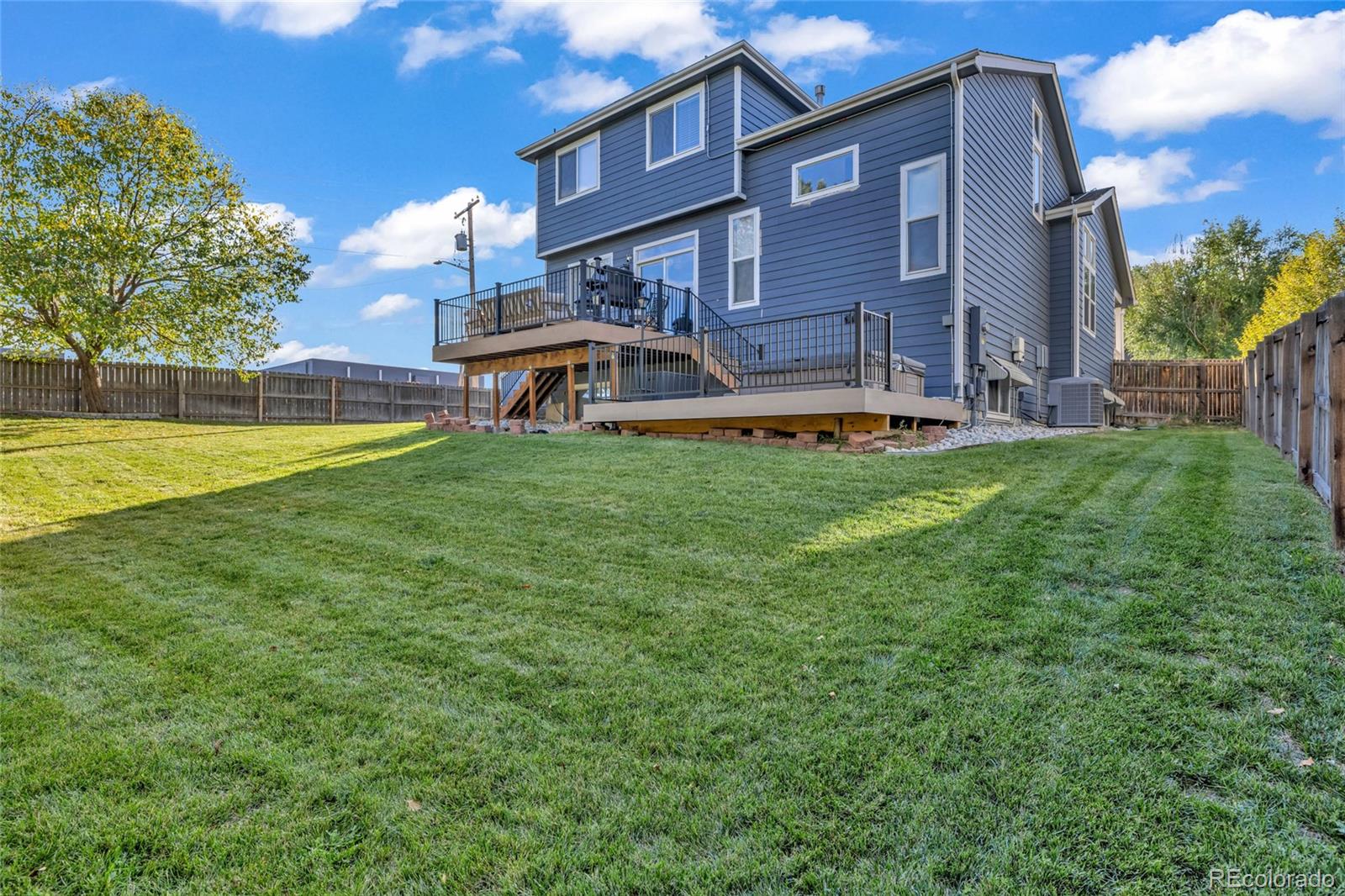 8204 Swadley Street Arvada, CO 80005 - Photo 33 of 39 a house view with a garden space