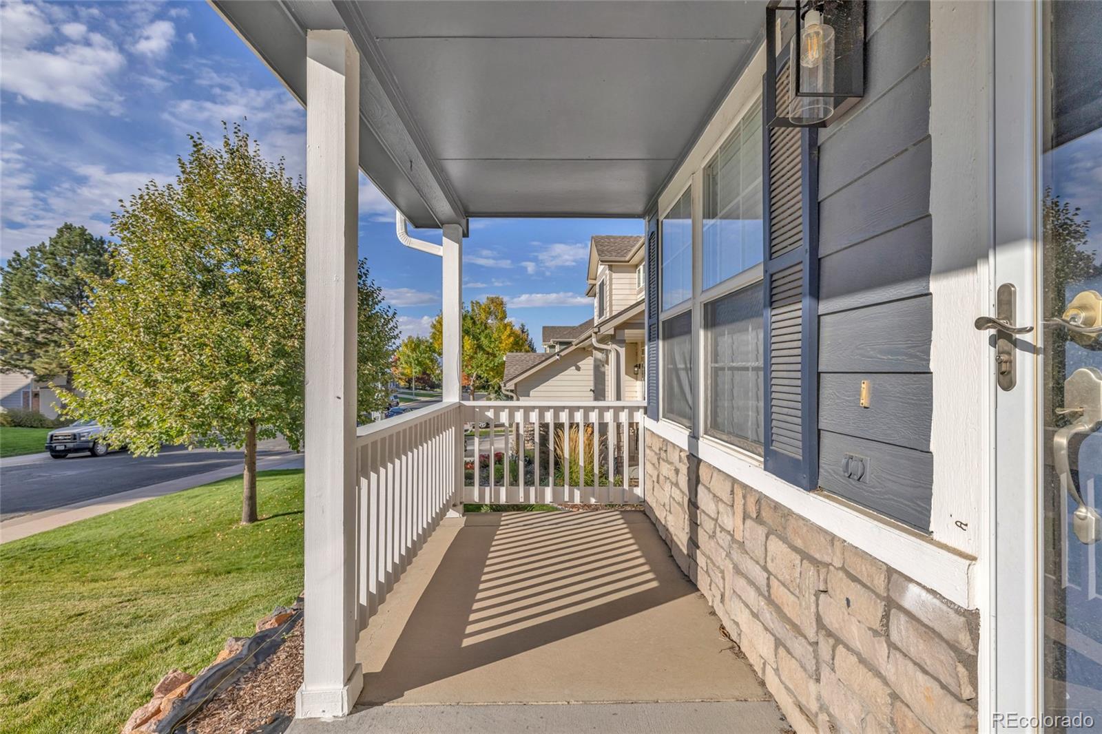 8204 Swadley Street Arvada, CO 80005 - Photo 4 of 39 a view of balcony with yard