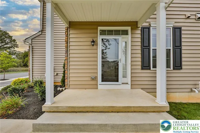 a yellow house with a outdoor space
