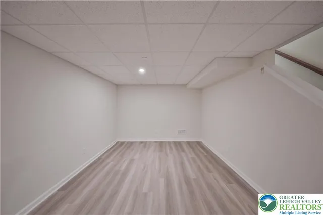 a view of room with wooden floor