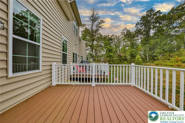 a view of a wooden roof with wooden floor and fence