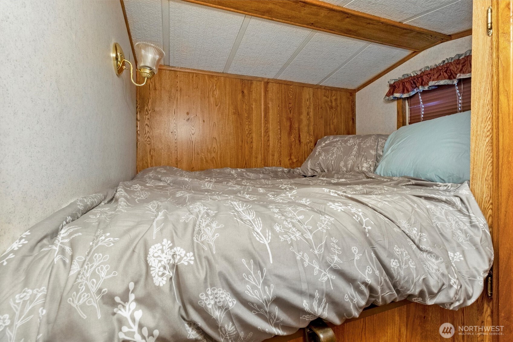 137-1 Jasper Trail Deming, WA 98244 - Photo 14 of 24 a bed sitting in a bedroom next to a window