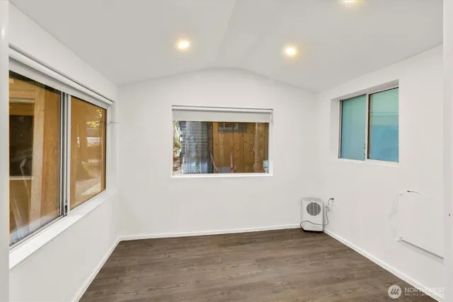 a view of an empty room with a window