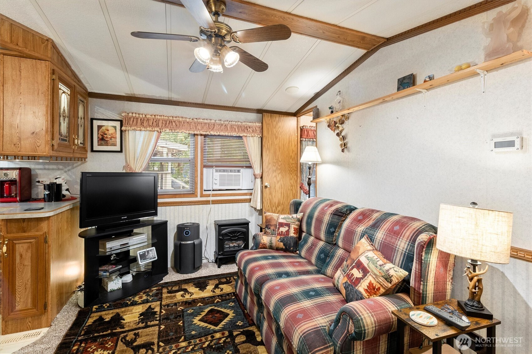 137-1 Jasper Trail Deming, WA 98244 - Photo 3 of 24 a living room with furniture a flat screen tv and a window