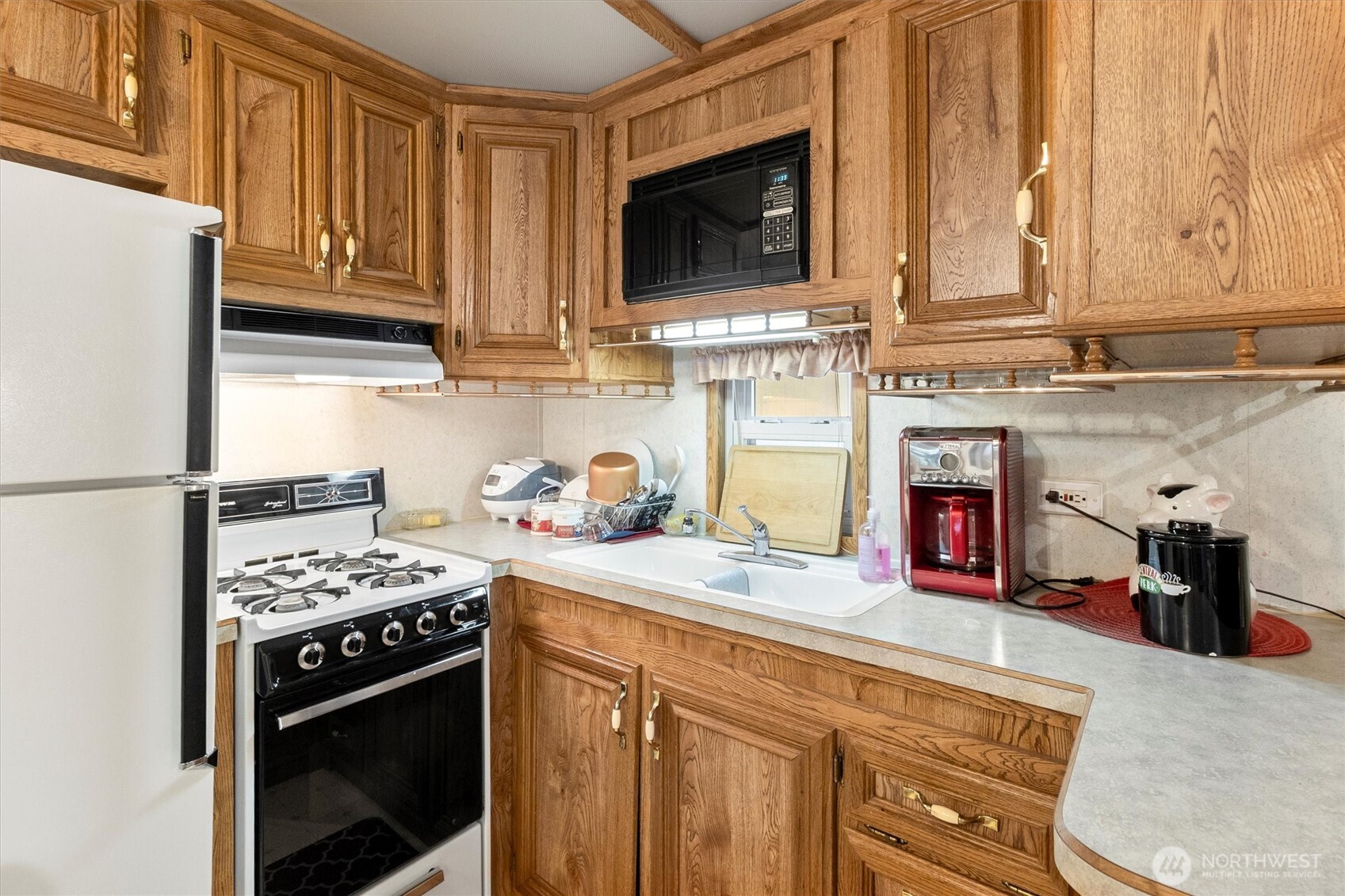 137-1 Jasper Trail Deming, WA 98244 - Photo 5 of 24 a kitchen with granite countertop a stove and a sink