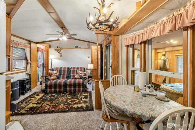 a very nice looking dining room with a large window