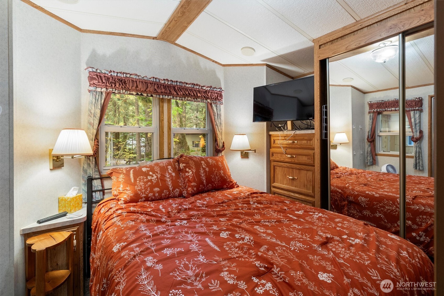 137-1 Jasper Trail Deming, WA 98244 - Photo 8 of 24 a bedroom with a bed and large mirror