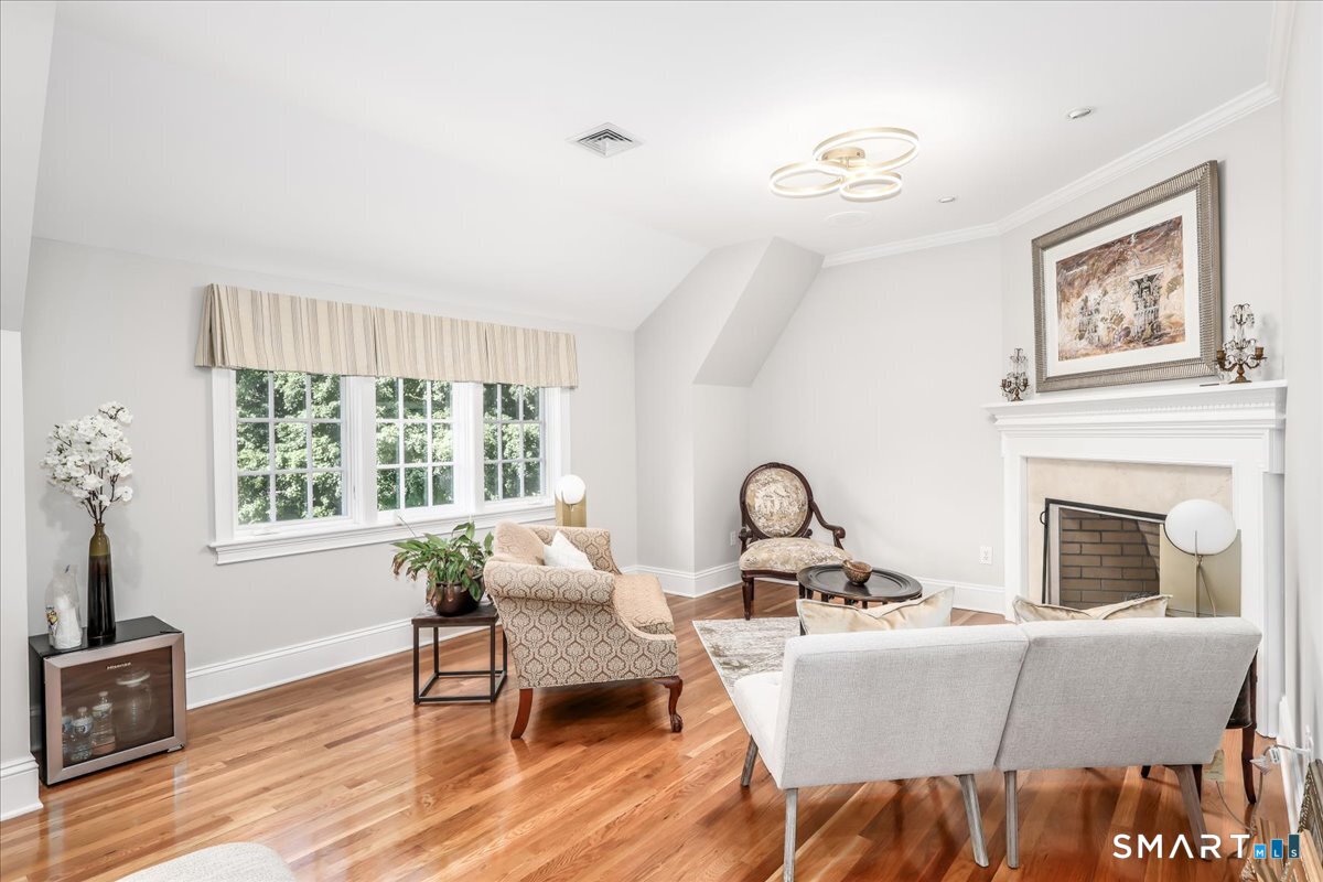170 Branchville Road Ridgefield, CT 06877 - Photo 18 of 36 Private sitting room with gas fireplace encompassing the grand primary suite.