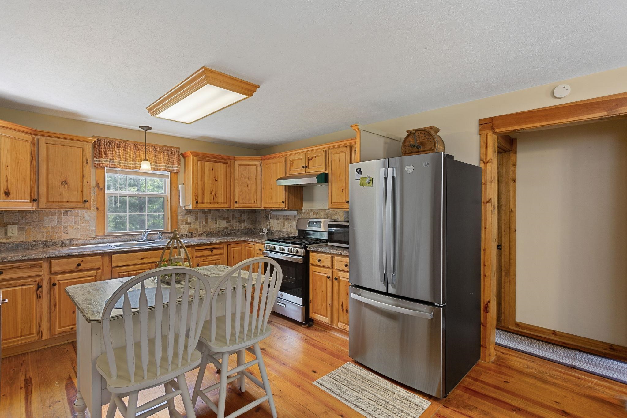 21117 Mine Mountain Road Bergton, VA 22811 - Photo 5 of 30 with family room and owners suite on the left and 2nd bedroom and laundry on the right