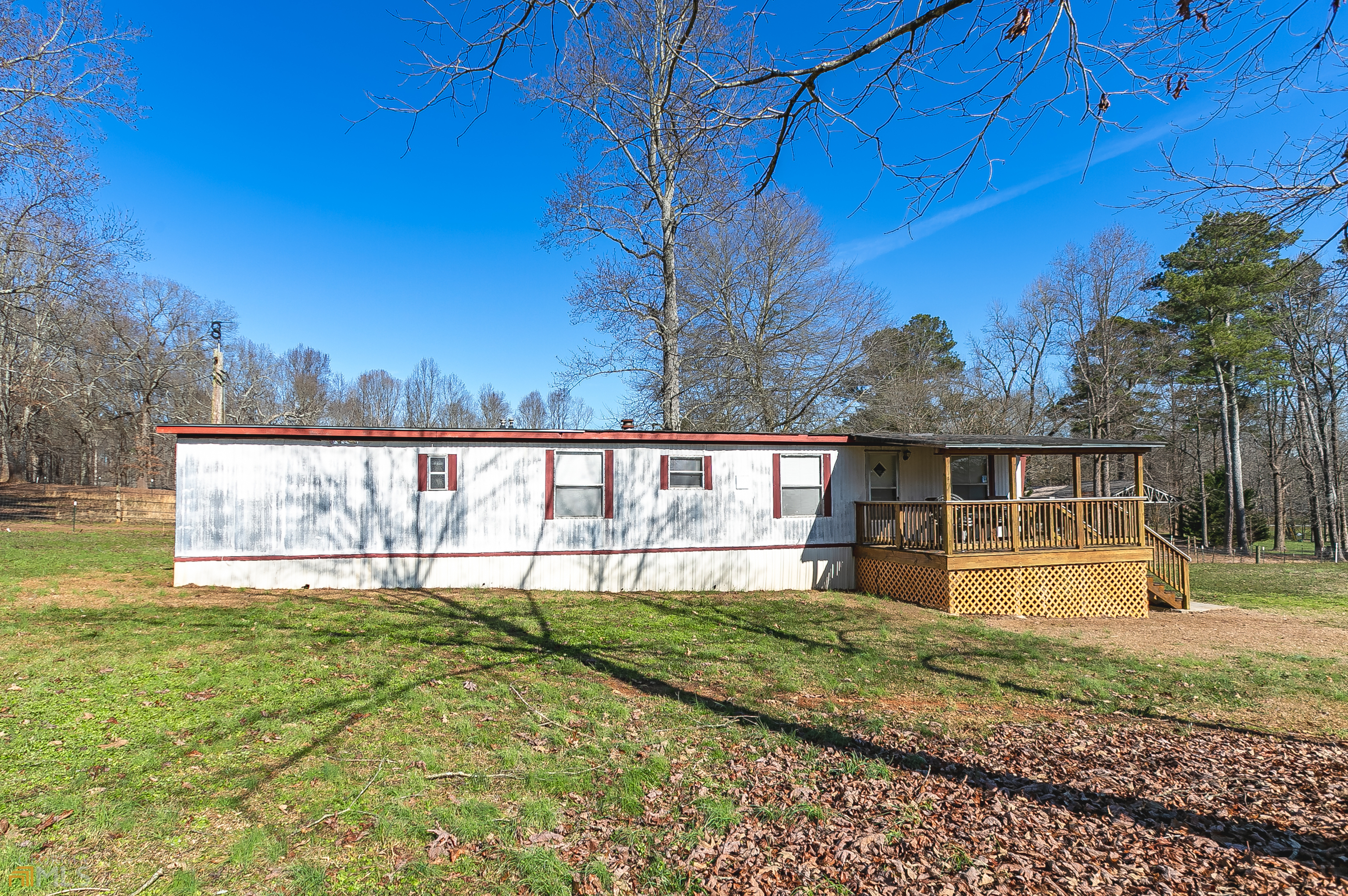 3996 Mark Lake Road Cumming, GA 30028 - Photo 1 of 1 a view of a house with backyard and garden