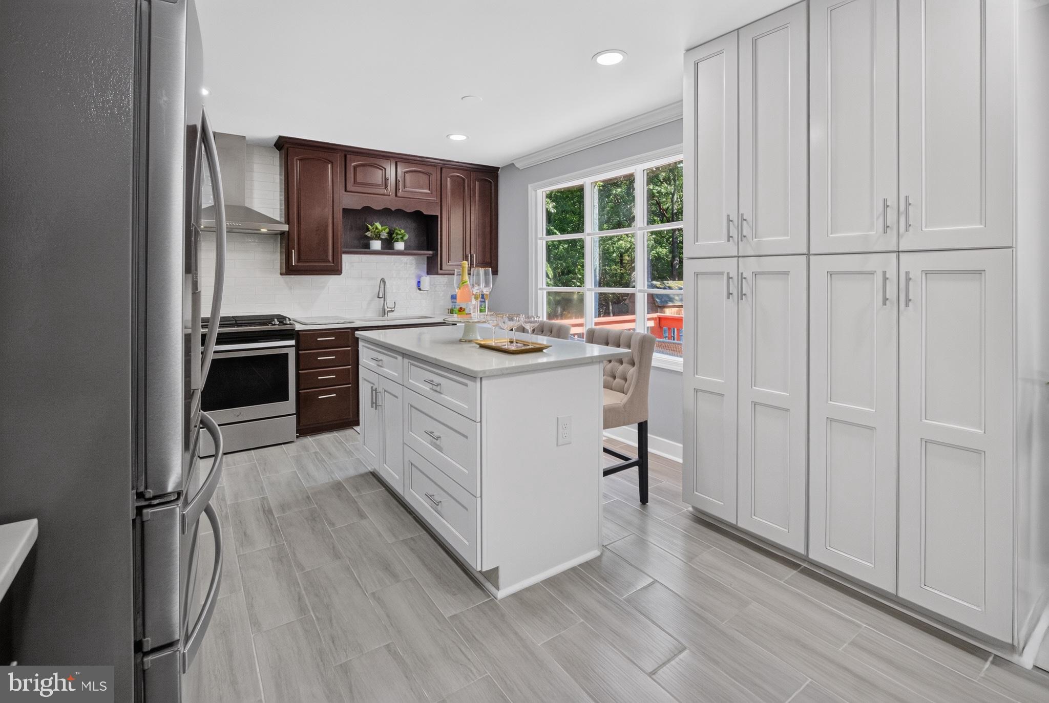 2816 Ridge Road Waldorf, MD 20603 - Photo 9 of 33 Modern kitchen with white cabinets and island.