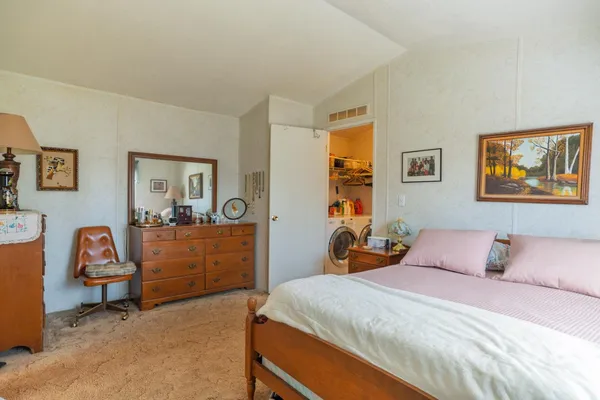 a bedroom with a bed and furniture