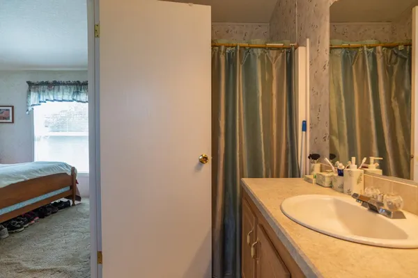 a bathroom with a sink and a mirror