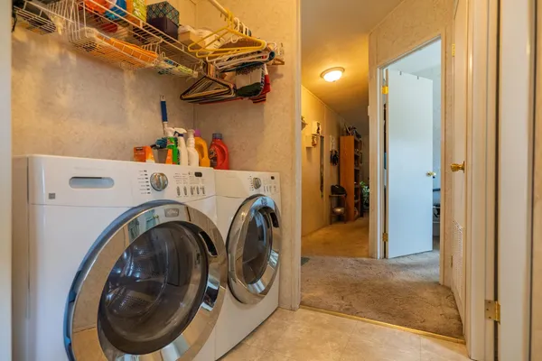 a utility room with dryer and washer