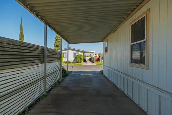 a aerial view of a house with a yard and potted plants