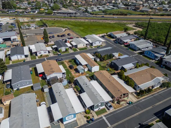 an aerial view of a house with outdoor space