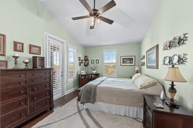 a spacious bathroom with a granite countertop sink a mirror and a shower