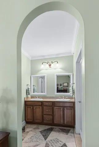 a bedroom with a bed a dresser and a book shelf