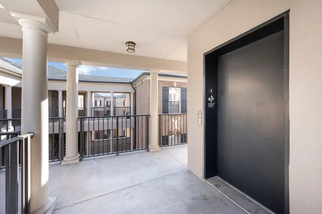 a view of a hallway with windows