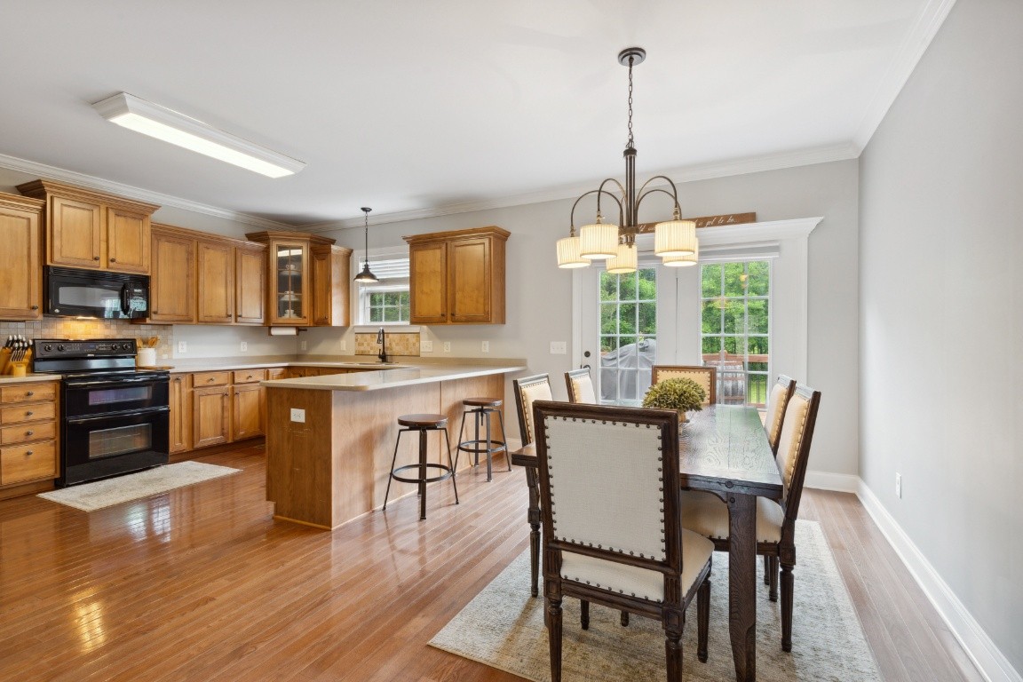 52 Abbey Road Lebanon, TN 37090 - Photo 11 of 40 a view of a dining room with furniture window and wooden floor