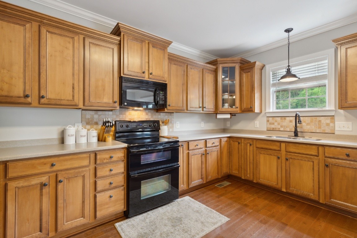 52 Abbey Road Lebanon, TN 37090 - Photo 14 of 40 a kitchen with stainless steel appliances granite countertop a sink stove and cabinets